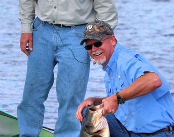 Tom Champeau with Johnny Morris and his 11 pound bass!