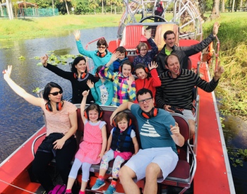 group of happy people on an airboat tour